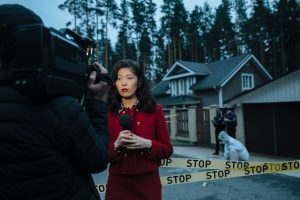 Female journalist reporting live from a crime scene with police and cameraman. — OZwin Online Casino: Quick Play, Big Wins, a